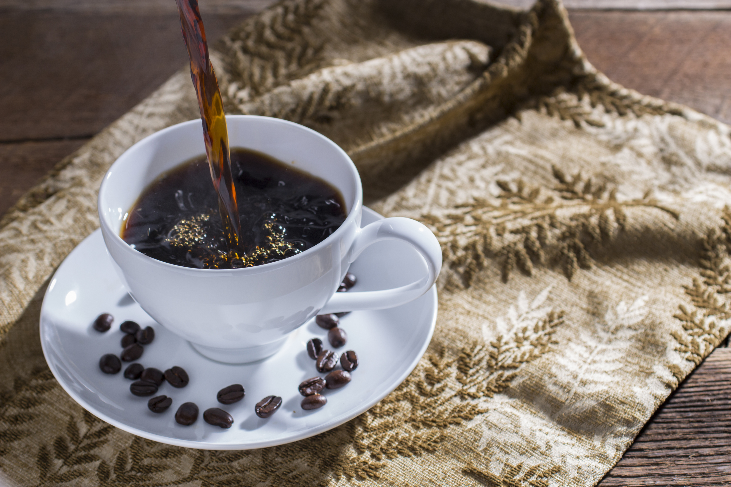 Coffee Pouring into Teacup