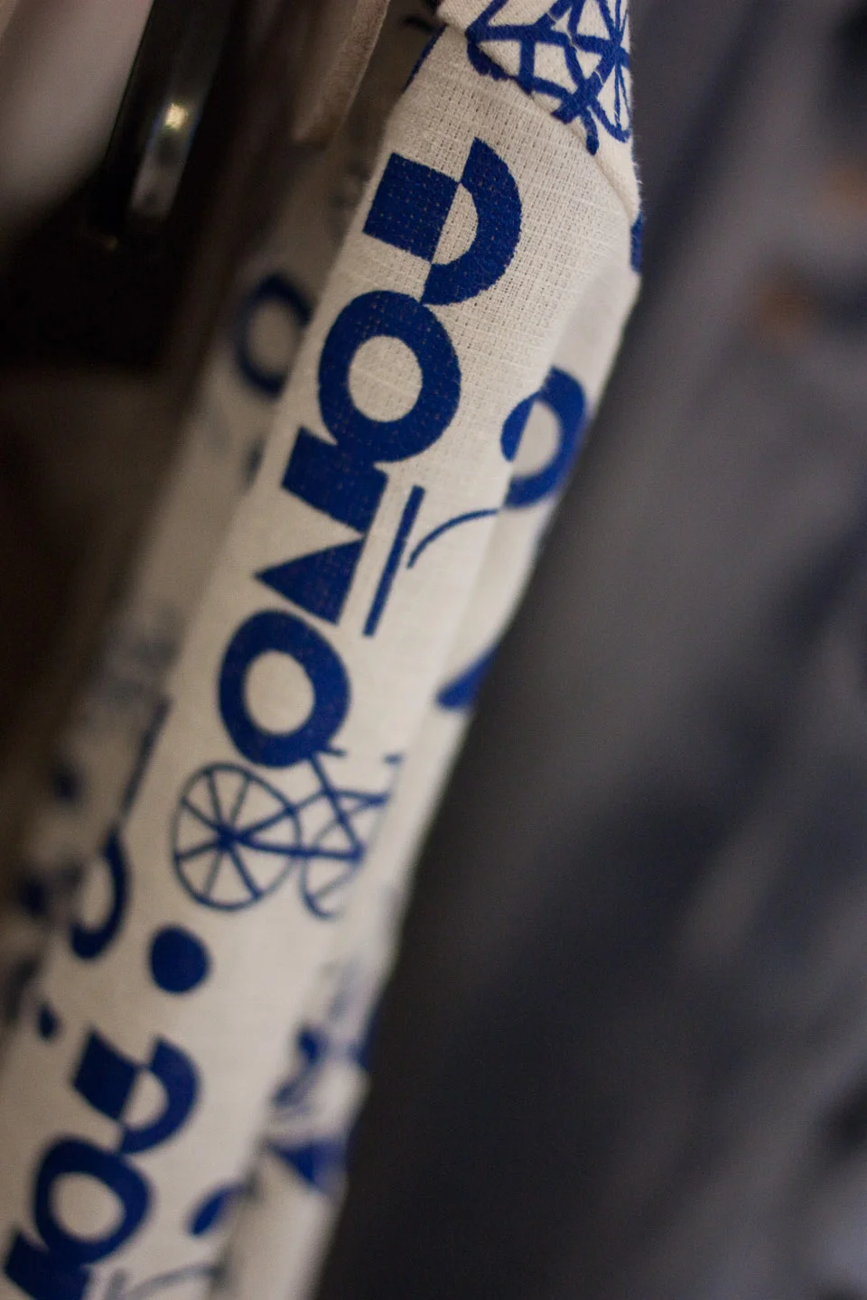 Auralis Studio Spring 2010 Bici Print by Rquel Berrios Close-up of fabric with blue geometric and bicycle designs.