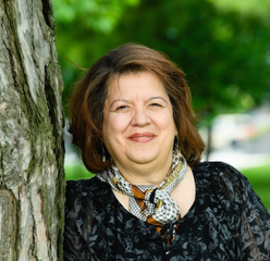 MARCH 20_IRINA MOGA_HEADSHOT.png