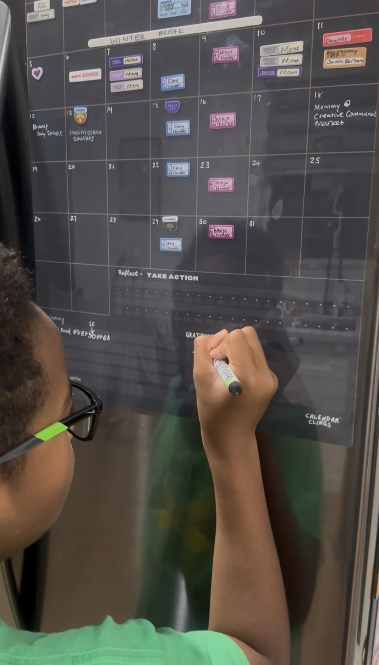 reusable dry erase calendar with colorful calendar clings for family scheduling