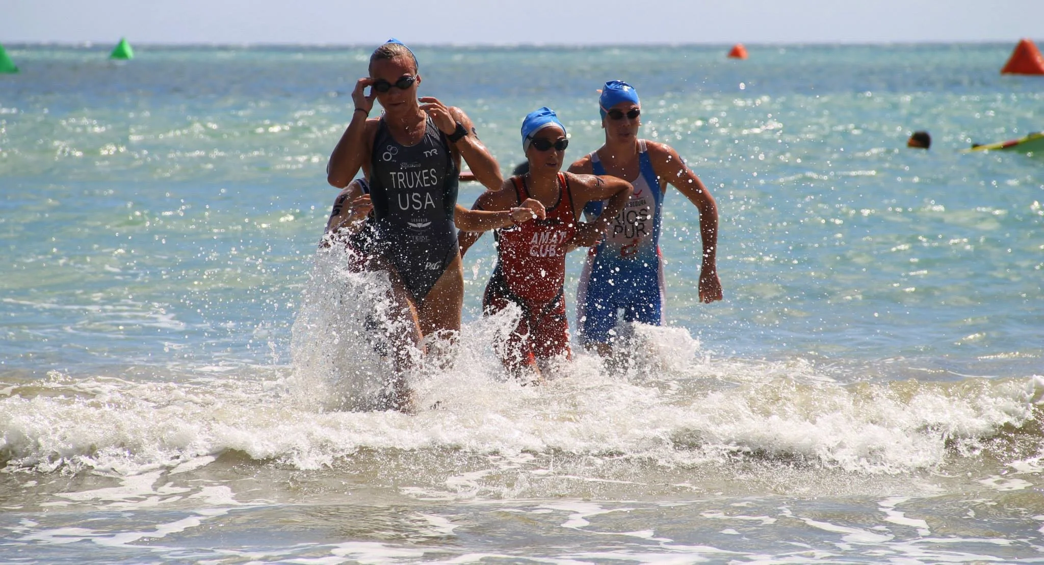 Coming out of the water in Puerto Rico with the girls that would become my bike pack.