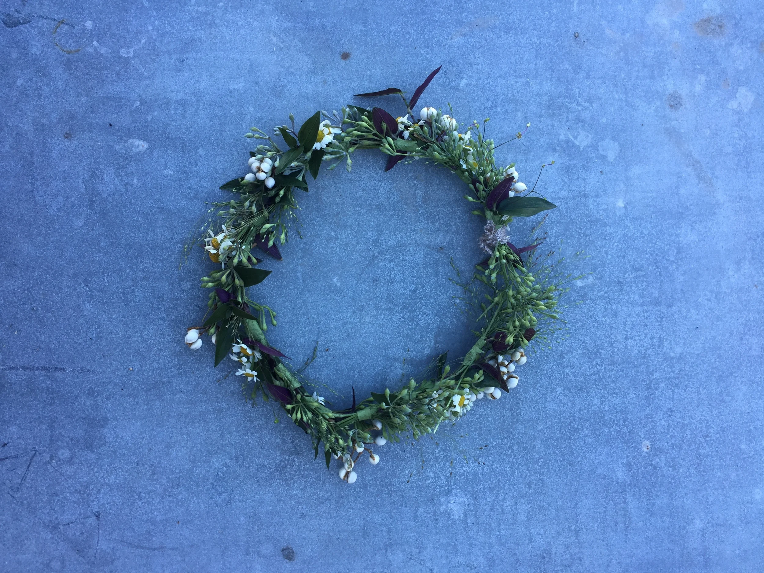 A simple flower crown for the bride made from wildflowers, bridalveil, and chamomile.