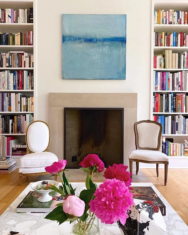 One of my very favorite spaces @laurabreilly. This is a house that showcases art so well - I am honored so many of my paintings get to live there! #interiordesign #art #kikislaughter #artandbooks #beautifulinteriors