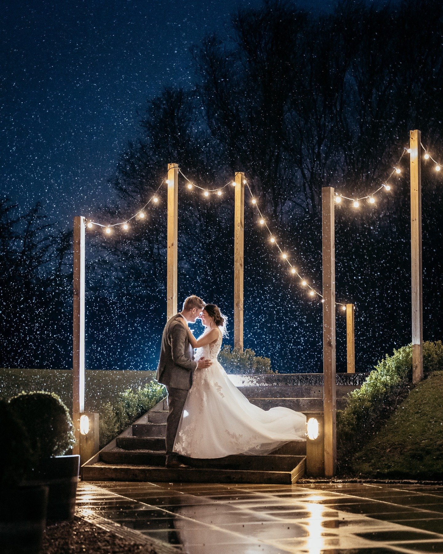 Briony &amp; Joseph embraced the wet weather under the moonlight and festoons, at the gorgeous West Mill Wedding Venue, Darley Abbey! - 

You'll usually find me making the most of the bad weather to capture shots like this, dusk light with plenty of 