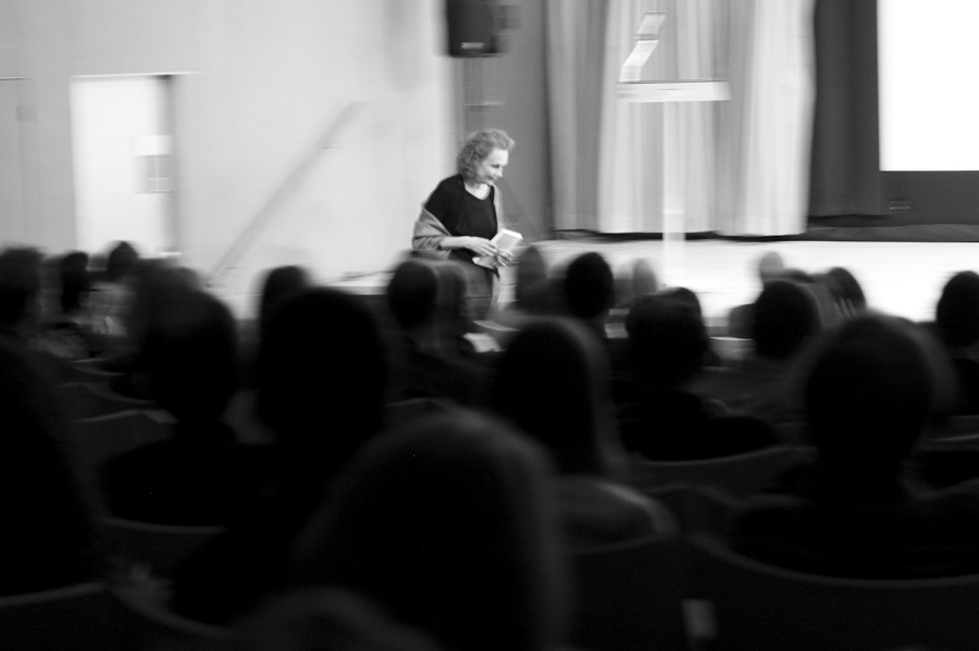 Kaija Saariaho passes before the full house