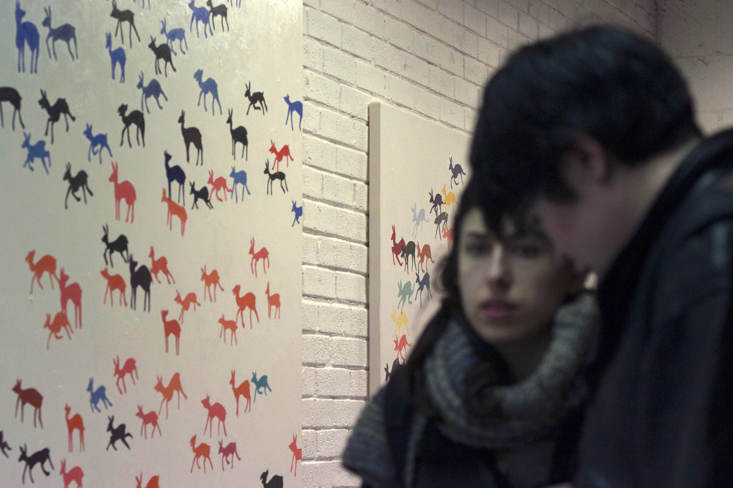 Audience members take in the work of Oliver Griffin.