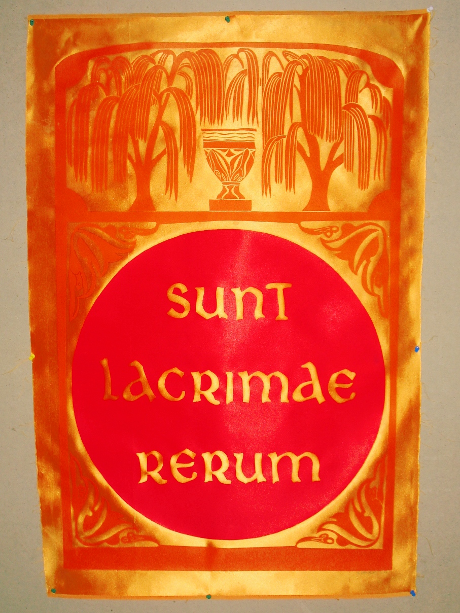 Red ink on gold satin.