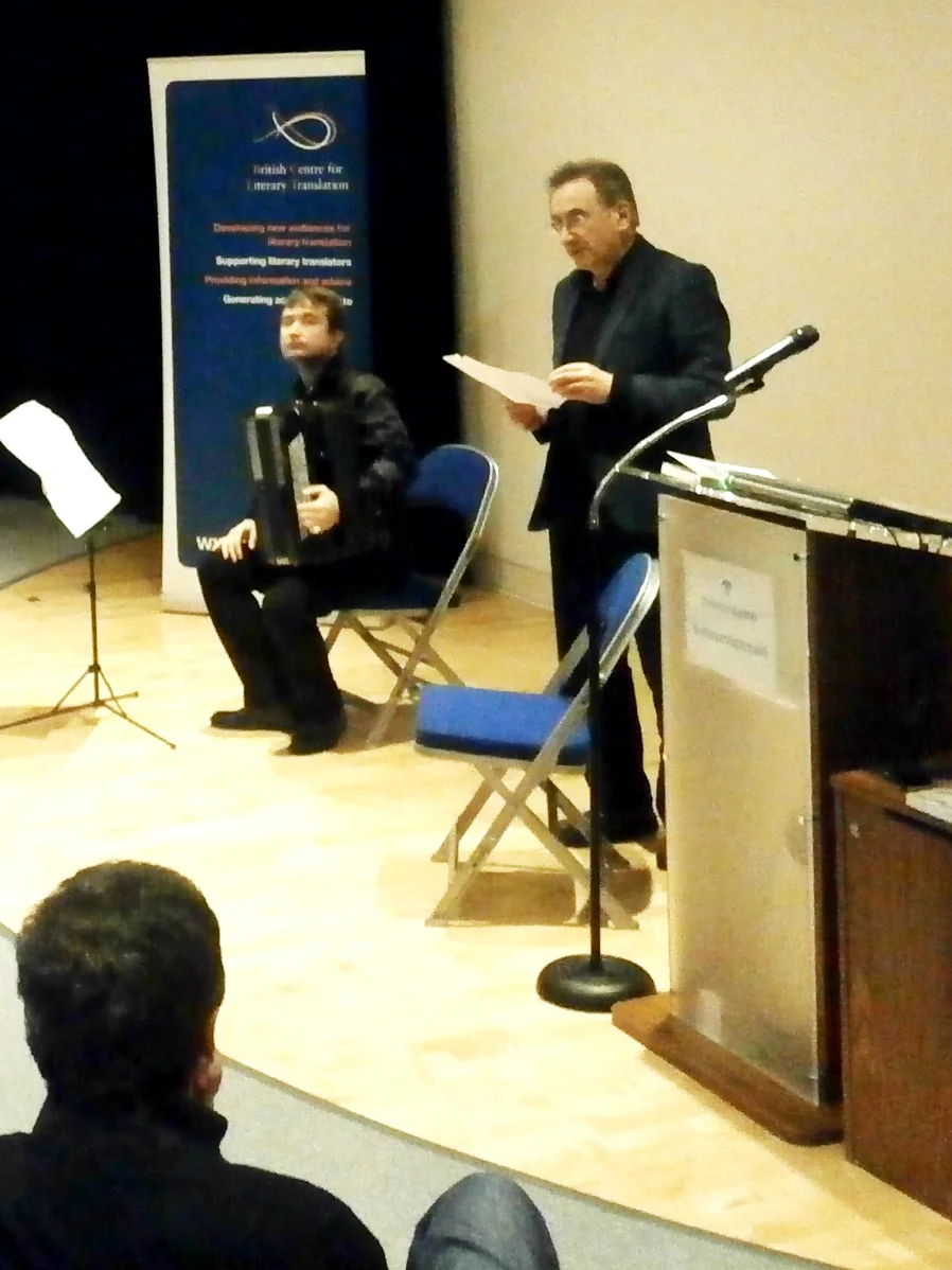 Roman Yusipey (L) with his accordion as George Szirtes (R) reads "Three Improvisations on Music"