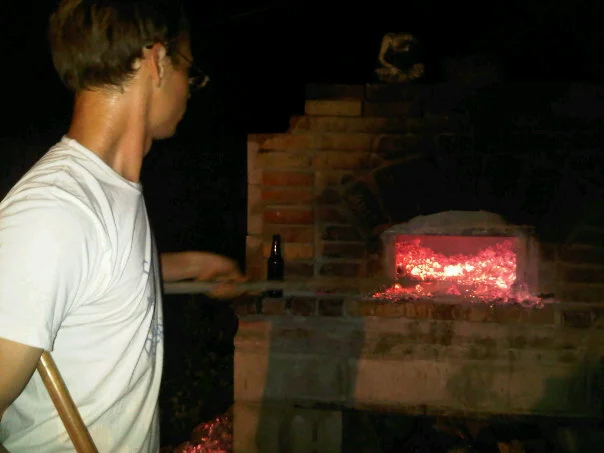 Daniel tending the 1500 degree hearth, circa 2009.