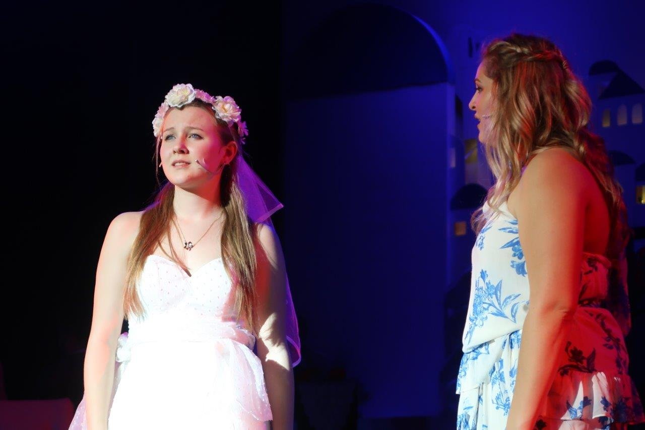  Sophie looking out in her wedding dress as Donna looks at her 