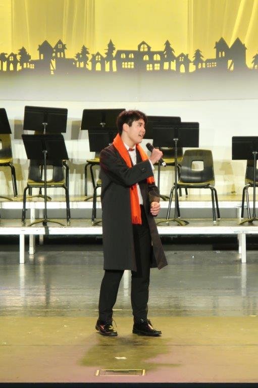  Singer in black coat and red scarf 