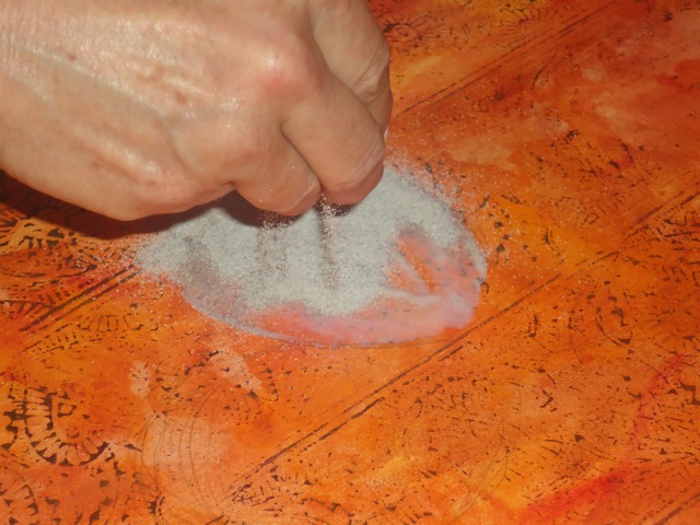 Sprinkle with sand.