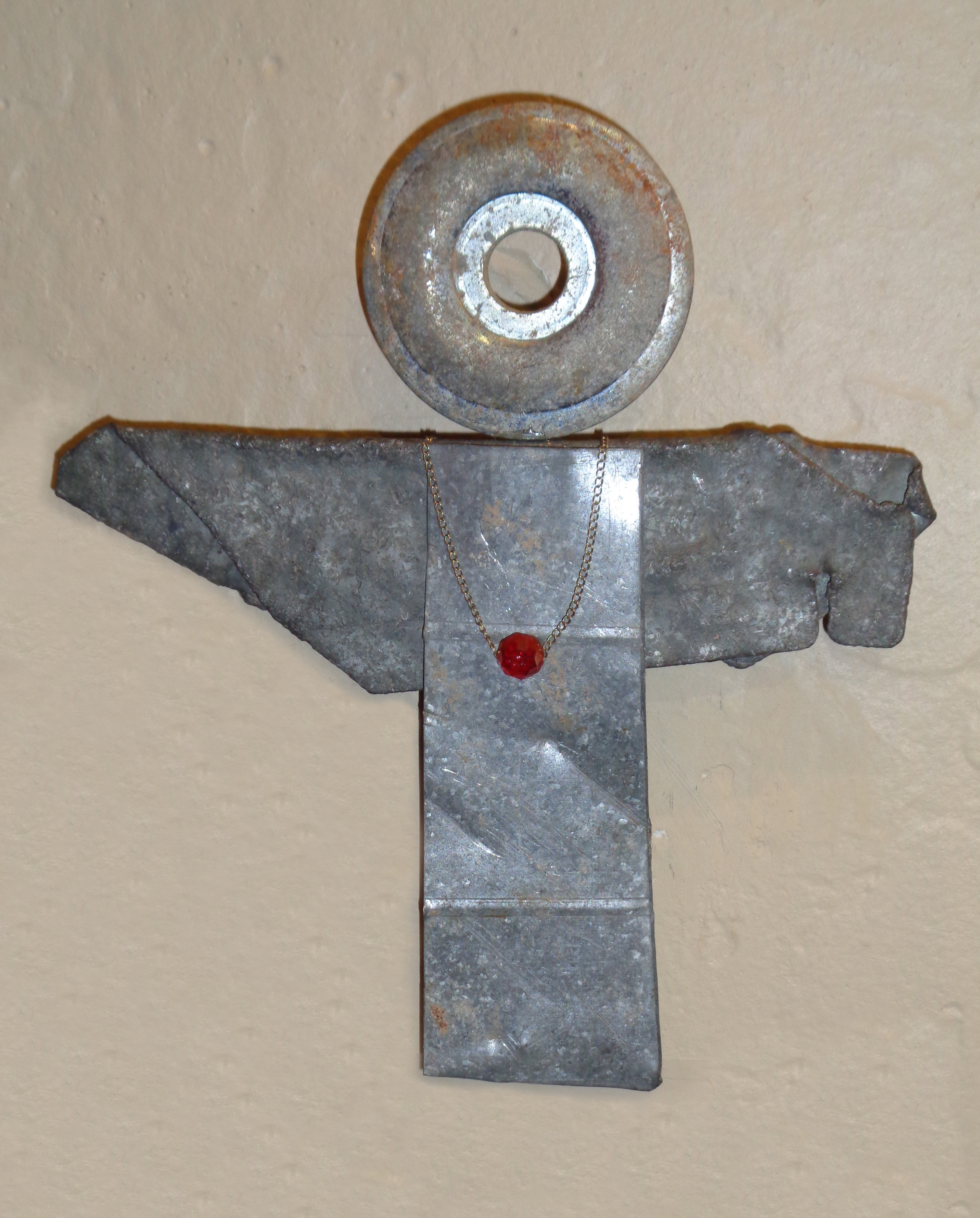 "This Way" mixed media, found pieces of metal, 5"h 