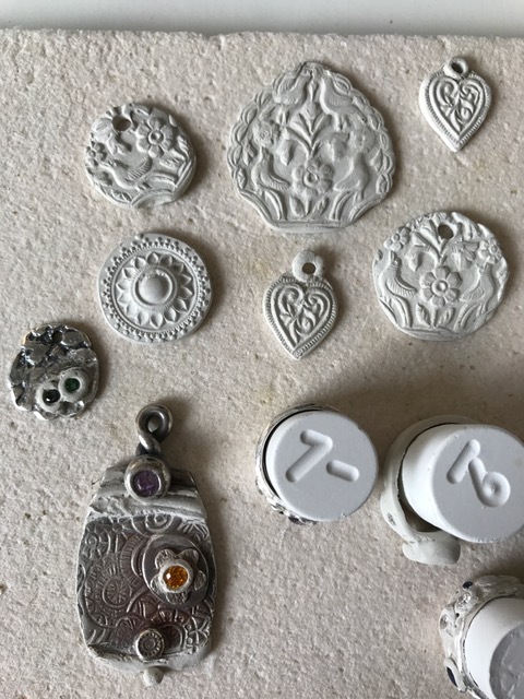 Some repairs to previously fired pieces and some new work going in the kiln.