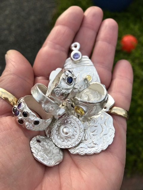 Powder brushed off to reveal fine silver.