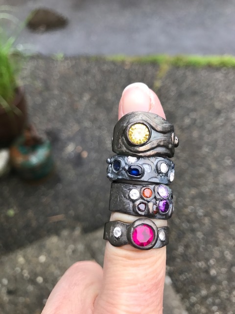 Rings have been oxidized and now will be polished to bring out design details.