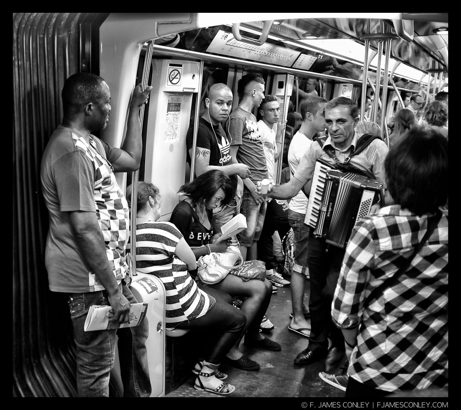 Lost in concentration on the Paris Metro.