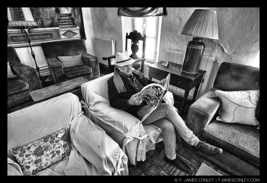 A "portrait" isn't head and shoulders. A "portrait" is a description of a person that provides at least some degree of insight about that person's character. Descriptions require context, and context in photography means going wider.
