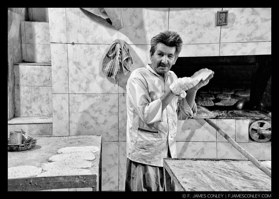 This Iranian baker's environment helps inform the portrait. Cropping it vertically would diminish the information the spectator could use to relate to him.