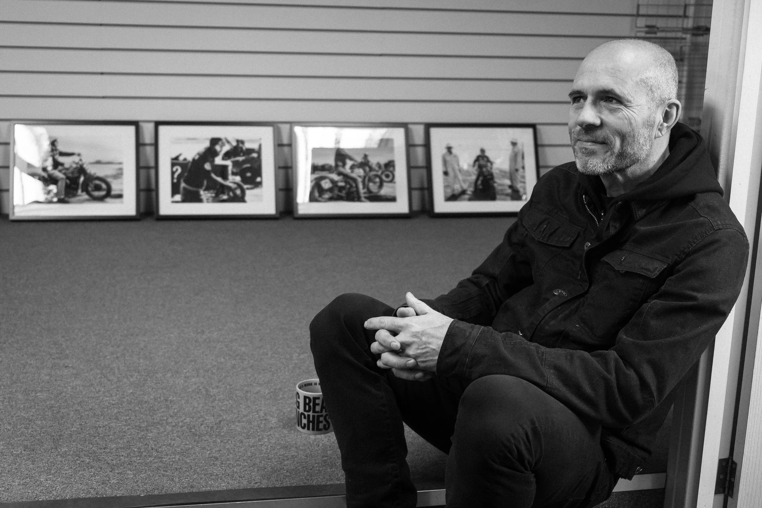 Paul Hayes-Watkins relaxing in his element at Grizzly’s, surrounded by prints from TROG.