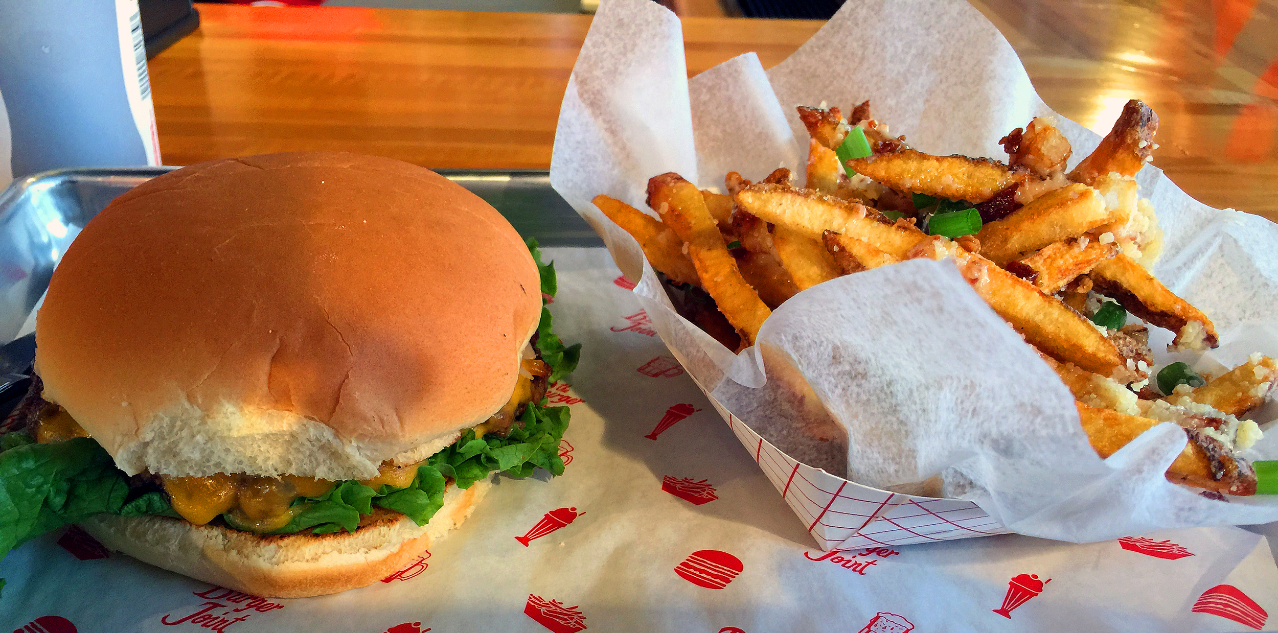 The Classic Burger with bacon & parm fries from The Joint.