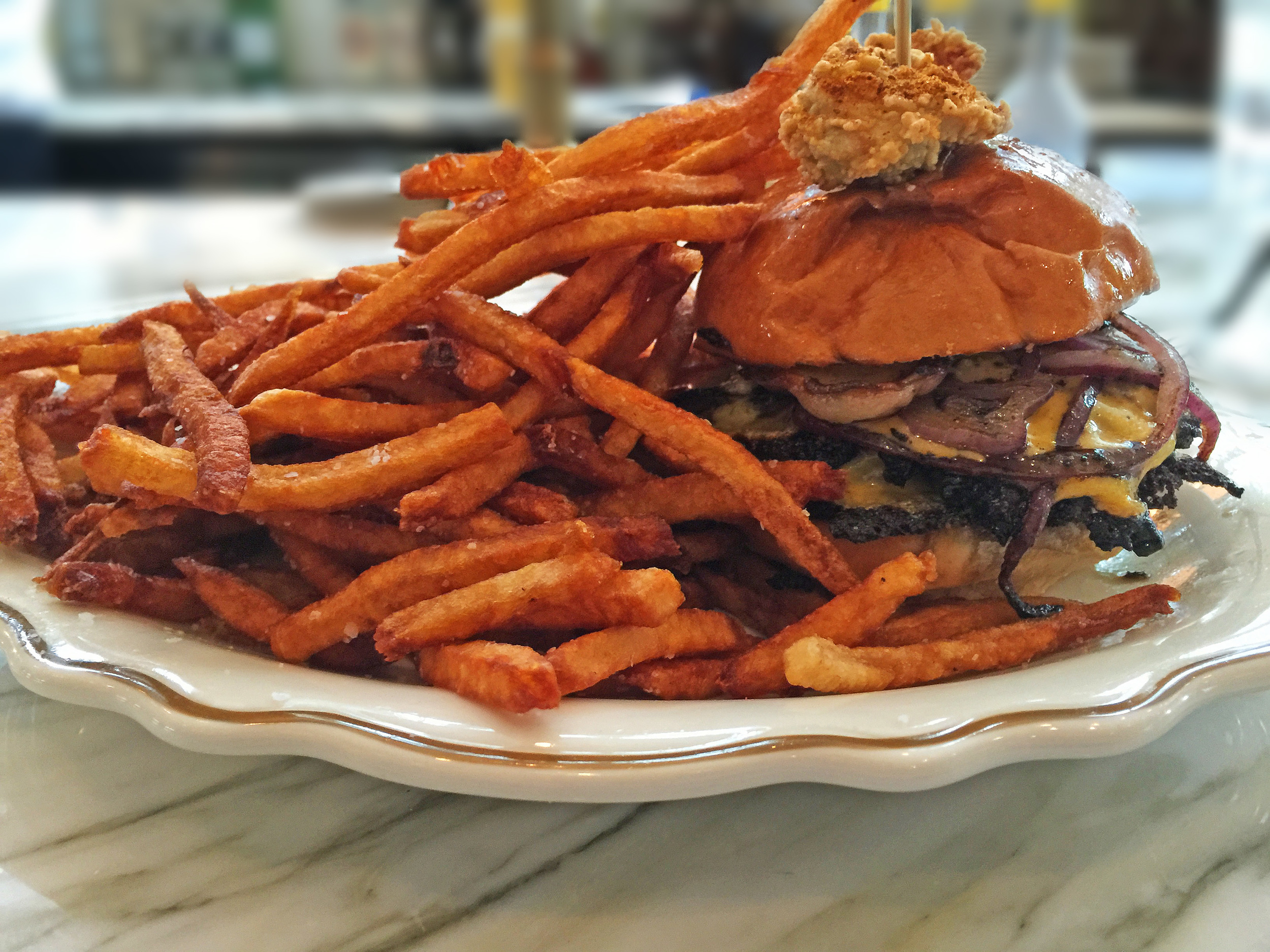 The delicious "Butter Burger" topped with a Carpetbagger Oyster from State of Grace