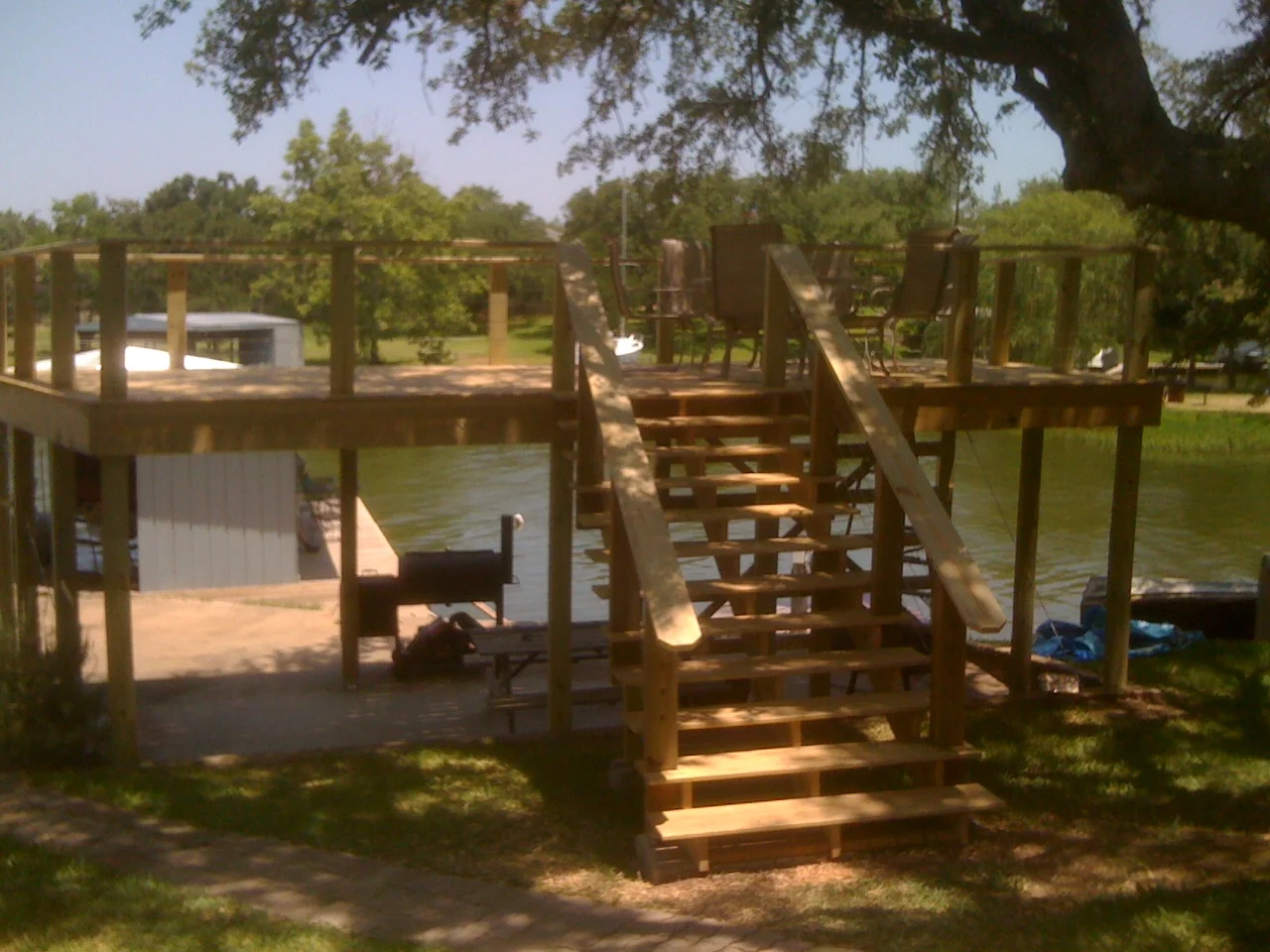  Lake LBJ raised deck over lake dock. (Dock also a Sparks creation). This deck had invisible railing system between top handrail and base deck. Wires provide safety and support without obscuring lake view. 