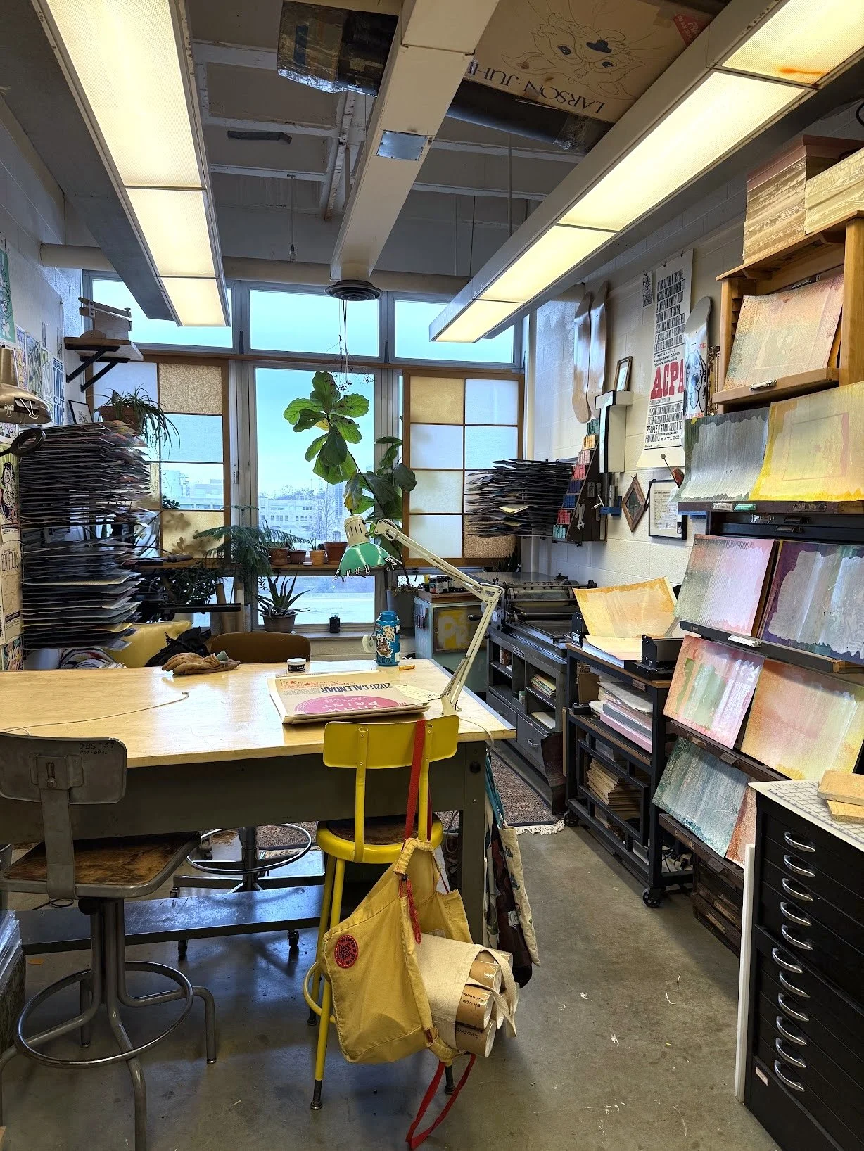 Small letterpress studio with a Vandercook proofing press and printing tools