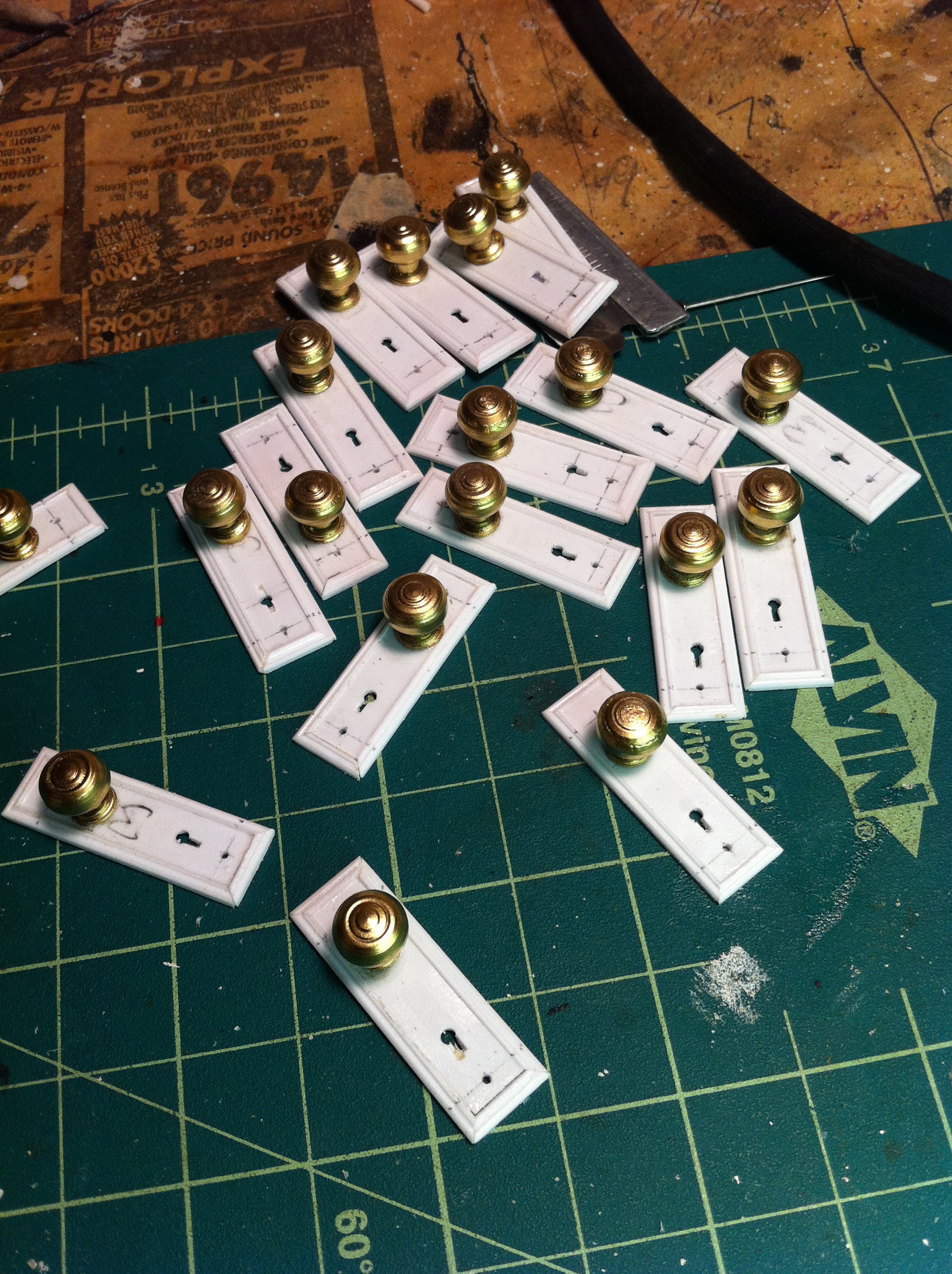 Makin miniature escutcheon plates and doorknobs for The Longest Hours.