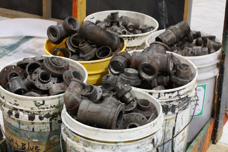 Makin buckets and buckets of hand-made pipe fittings for site-specific installation, Uprising, Suyama Space, Seattle.