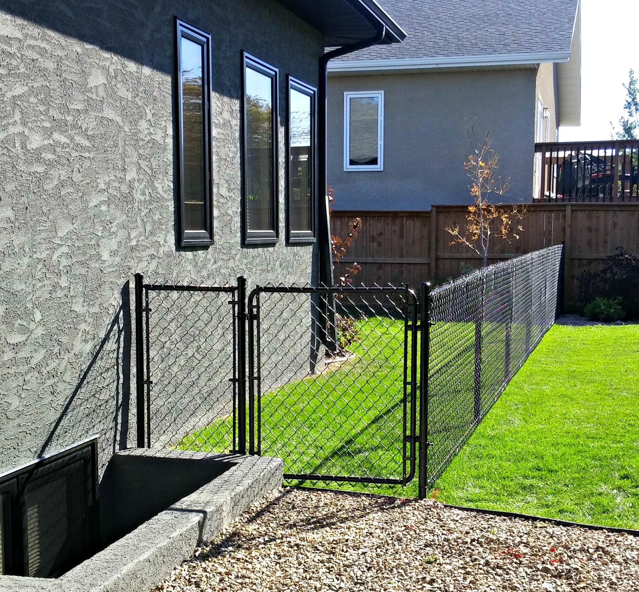 Black chainlink fence with gate