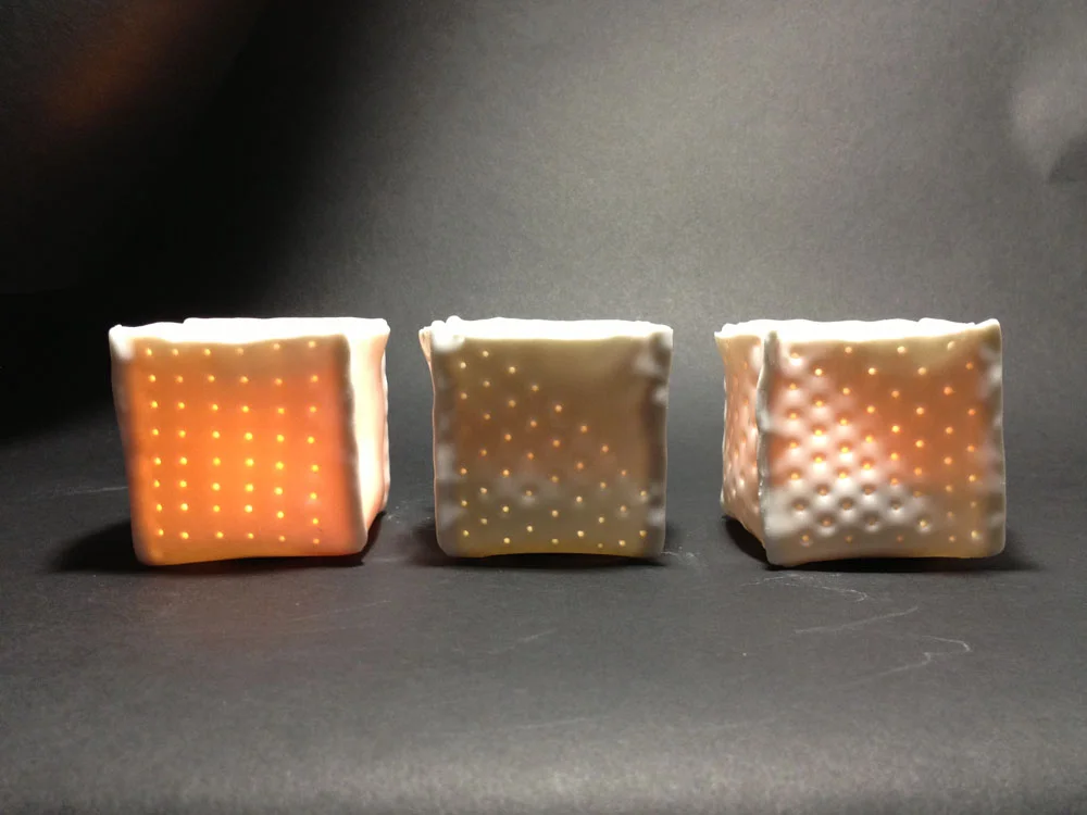 Pierced porcelain votive candleholders. 2" x2". Many sizes and shapes available. 