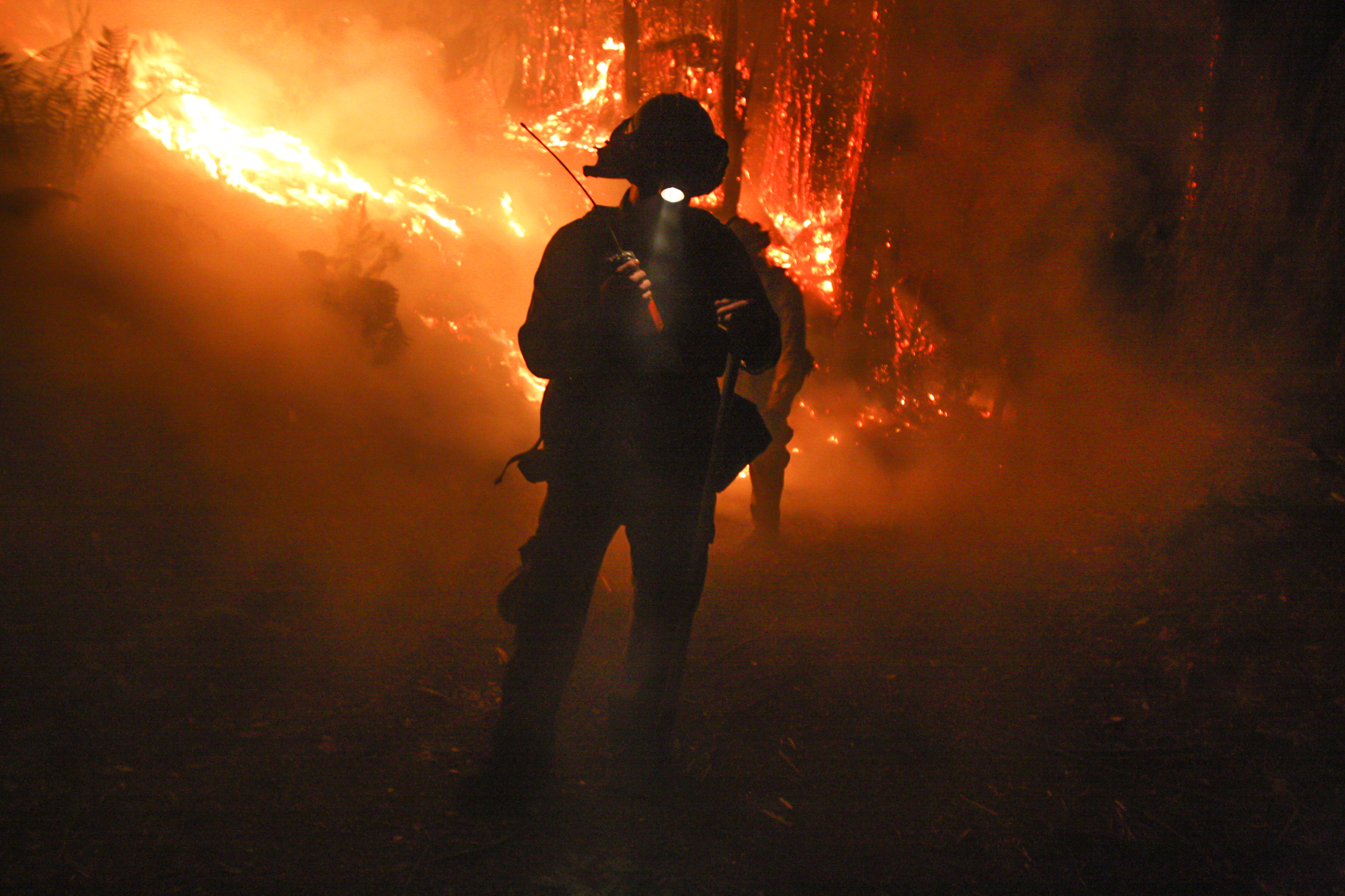  A firefighter watches to make sure the fire does not jump a &nbsp;fire road in Corralitos, California, during the Summit Fire which burned 4,270 acres.&nbsp; 