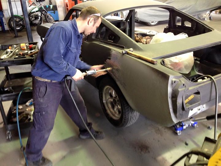 A dent puller is used to get the basic shape back.