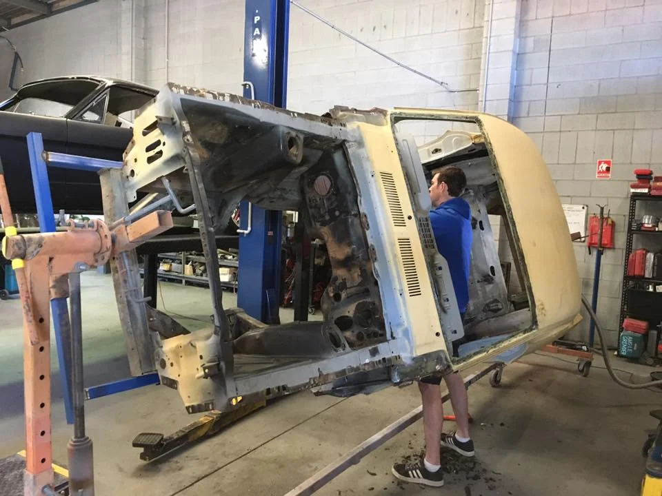 Shane strips the factory sound deadener off the '67 Mustang. It needs to be removed before the car is sand blasted later this week.