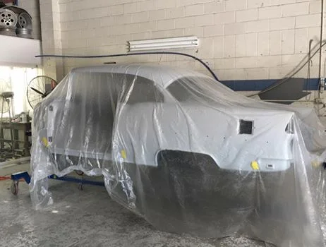 The body sits in epoxy primer waiting for body work to commence on the exterior. But the underside and firewall are almost ready for paint.