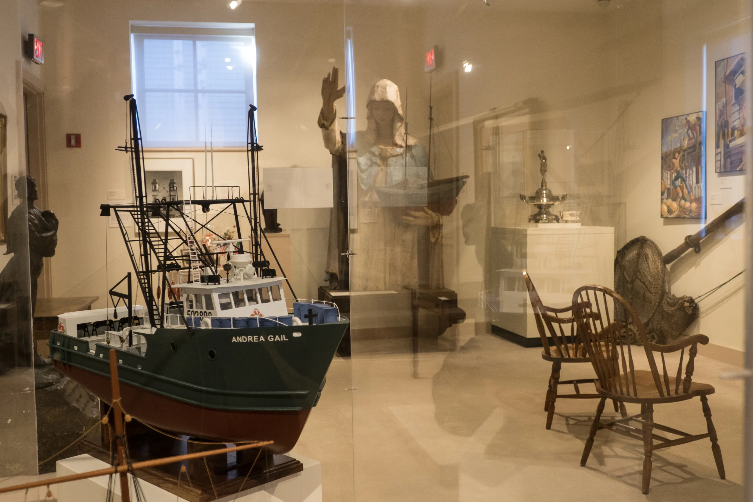   The original Our Lady of Good Voyage statue displayed in the Cape Ann Historical Museum. It sat on the Portugese Lady of Good Voyage Church on Prospect st. looking out on the waterfront from 1915 to 1985, the boat she holds and hand blessing symbol