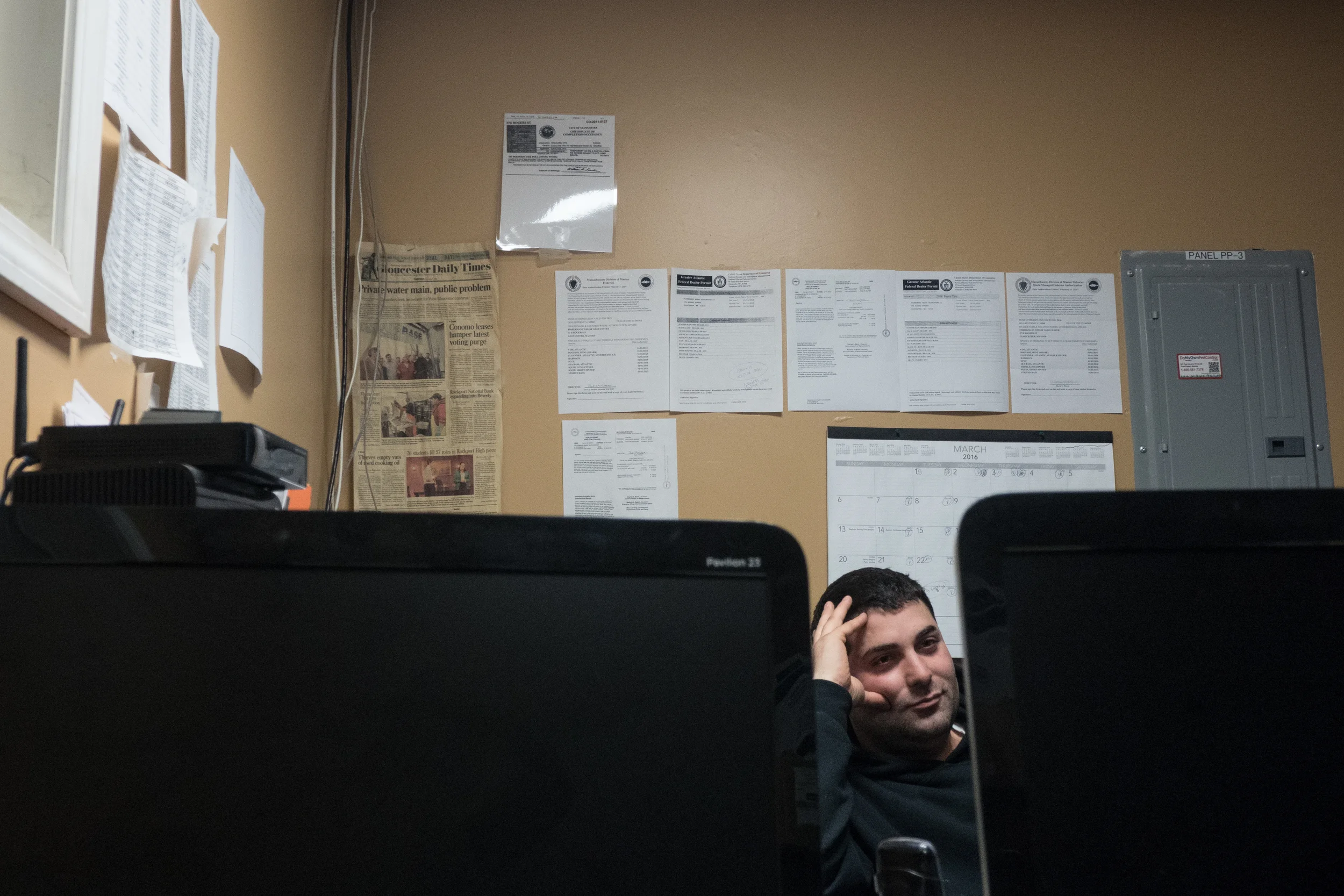   Nick watches the digital fish auction from his desk. Bidding opens at 6 AM and on average, 15 to 25 buyers bid for fish packages until it has all been sold. On the wall is a list of 25 day dragger’s that unloaded to them in 2008, now its down to th