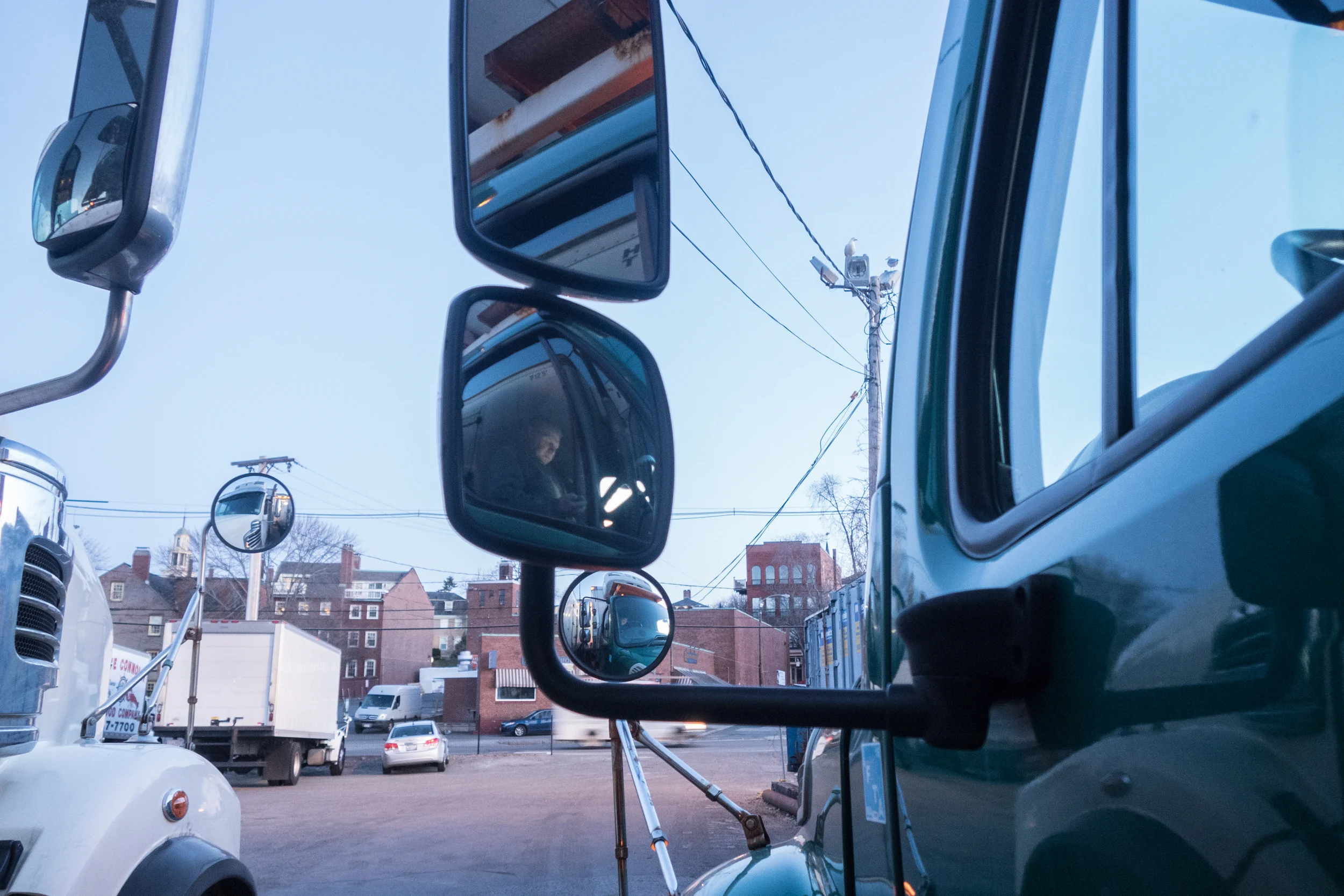   Mike waits in his truck outside the Fisherman‘s Wharf at 6am in Gloucester. Eight truck drivers and Wharf crew arrive early, load up the trucks after the catch has been sold and usually unload to around seven buyers each.  