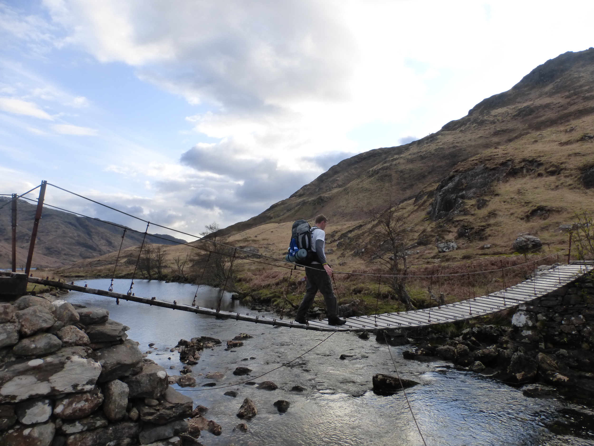 Gary is the first to cross the dodgy bridge over the River Carnoch