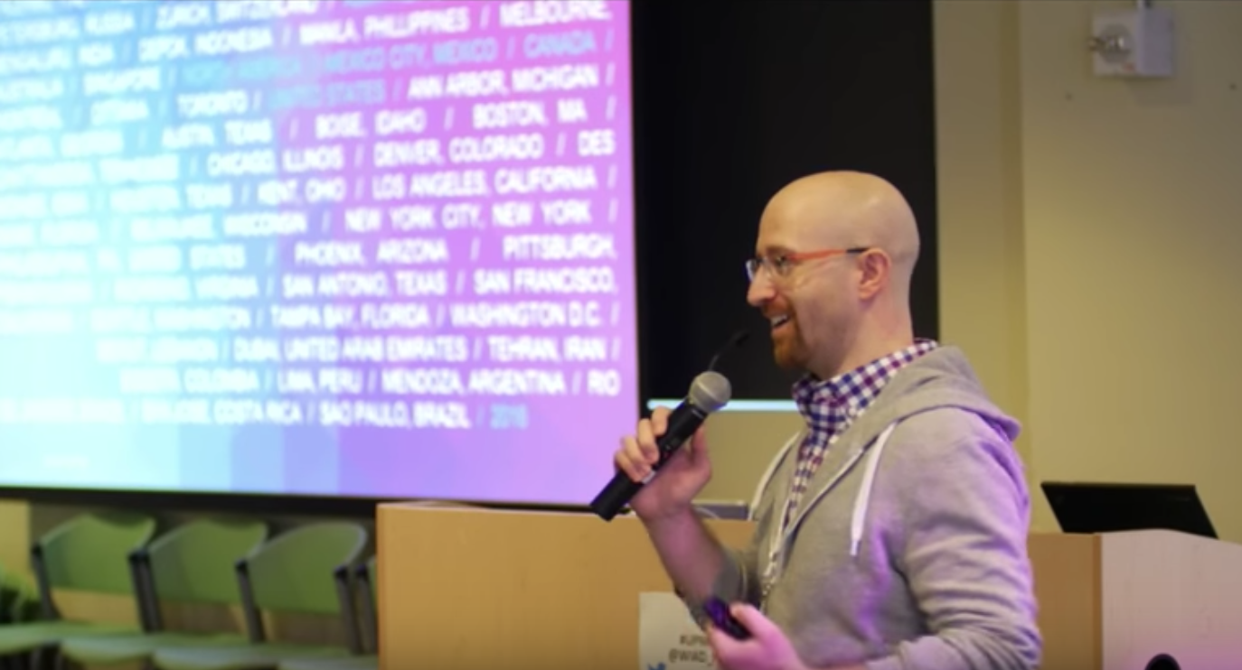 Delivering opening remarks as host.