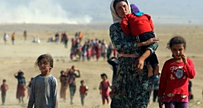 Exhausted and traumatized Christians from villages in northeastern Syria travel by foot seeking refuge after their small communities were terrorized.