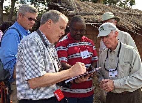 Left to right, Donovan Drake, Tom Widmer, Nedson Zulu, Berry Long, Tom McDow reviewing plans for Leadership Training Center