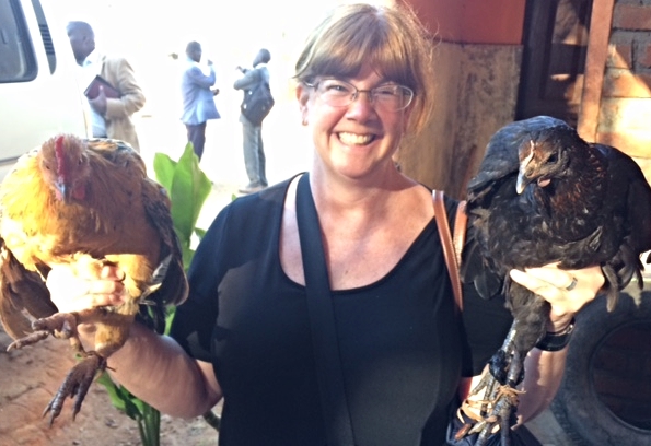 Heidi Meadows holding gifts of chickens! 