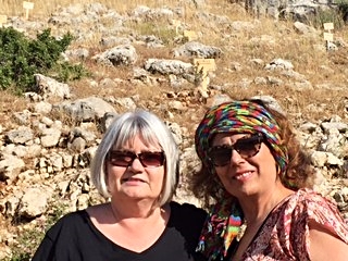 Marilyn and Sanaa in front of The Outreach Foundation cedar tree, #4126 in the reserve.