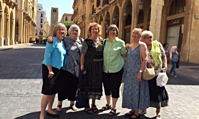 Louise Westfall, Marilyn Borst, Patti Gatzke, Kate Kotfila, Julie Burgess and Meryle Gaston gather together in front of the clocktower on Parliament Square, Beirut.
