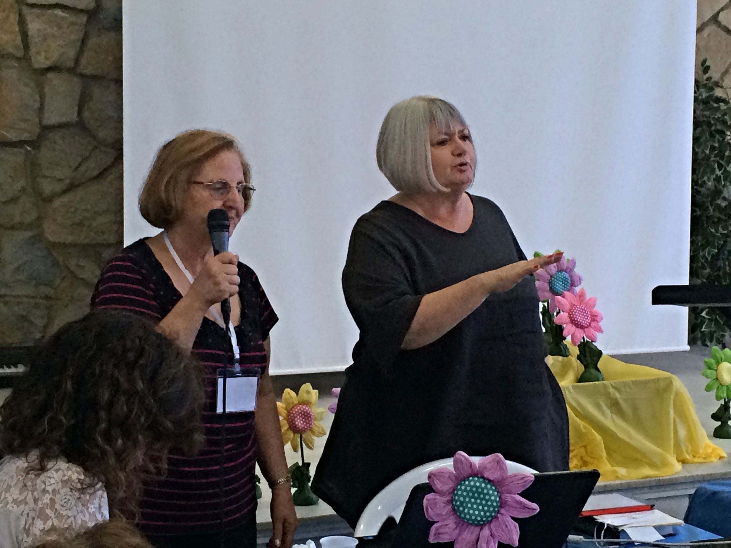Dr. Mary Mikhael translates for our Arabic speaking sisters as Marilyn leads us in the story of the woman at the well.