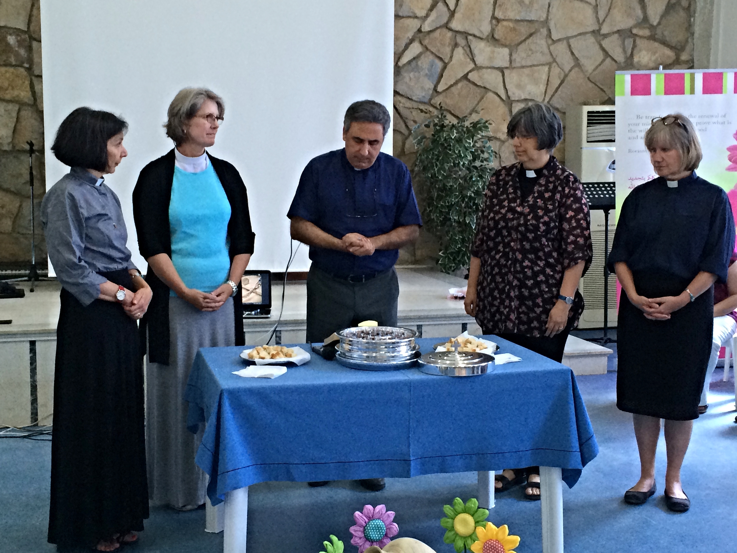 Five pastors at the table of the Lord: Lisa from Florence, So. Car.; Toby from Decatur, Geo.; Josef from Beirut; Kate from Cambridge, N.Y.; Louise from Denver, Colo.