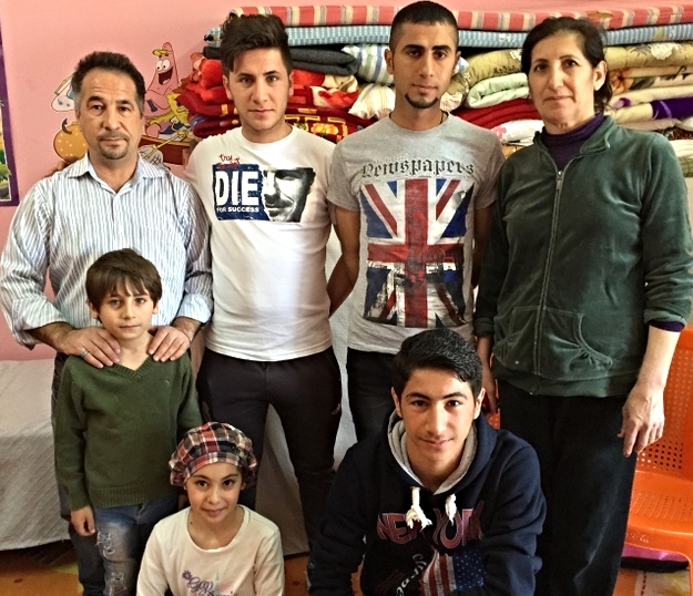 This Syrian Orthodox family from the Nineveh Plain is grateful for their new “home” in a 12’ x 30’ Sunday School room at the Kirkuk church. It holds everything they now own.
