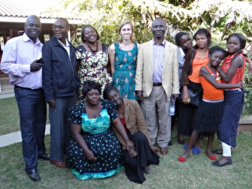 Becca, a 2014-2015 YAV, surrounded by various YAV Zambia supervisors and host family members